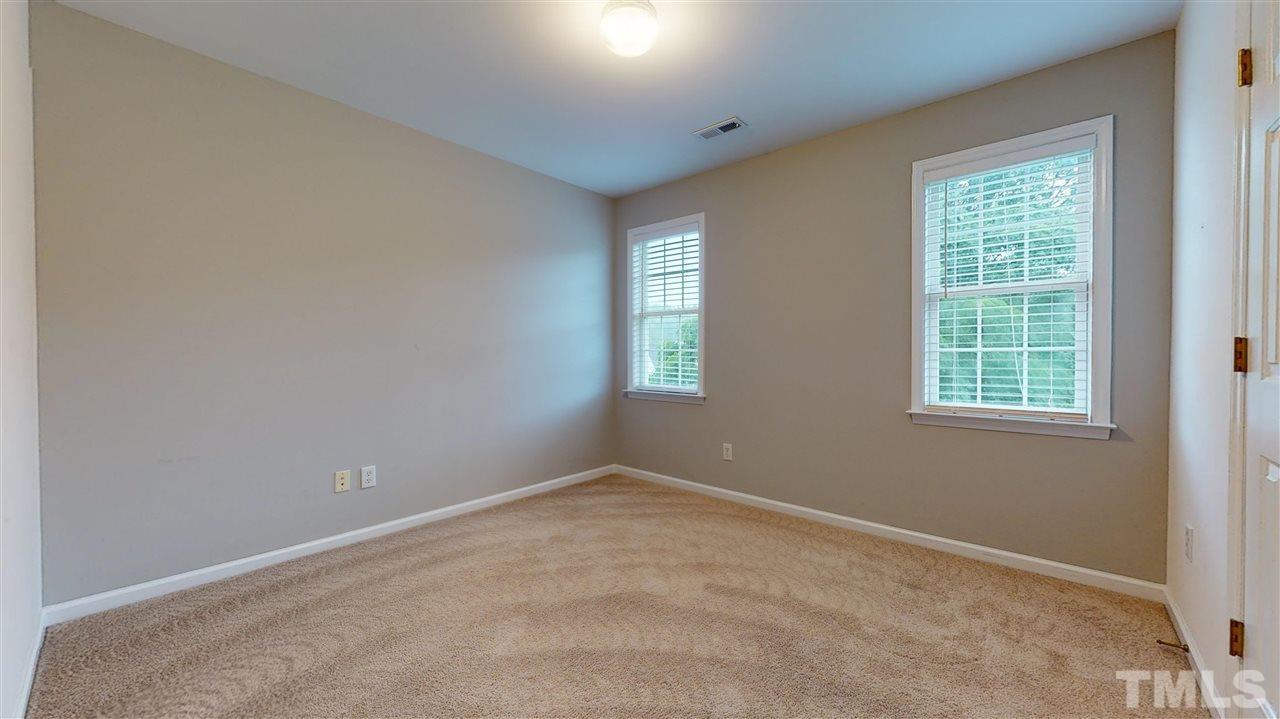 4840 Topstone Road Raleigh, NC 27603 - Photo 24 of 30 an empty room with windows