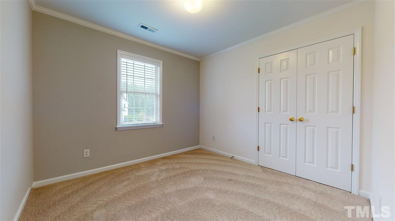4840 Topstone Road Raleigh, NC 27603 - Photo 27 of 30 an empty room with windows