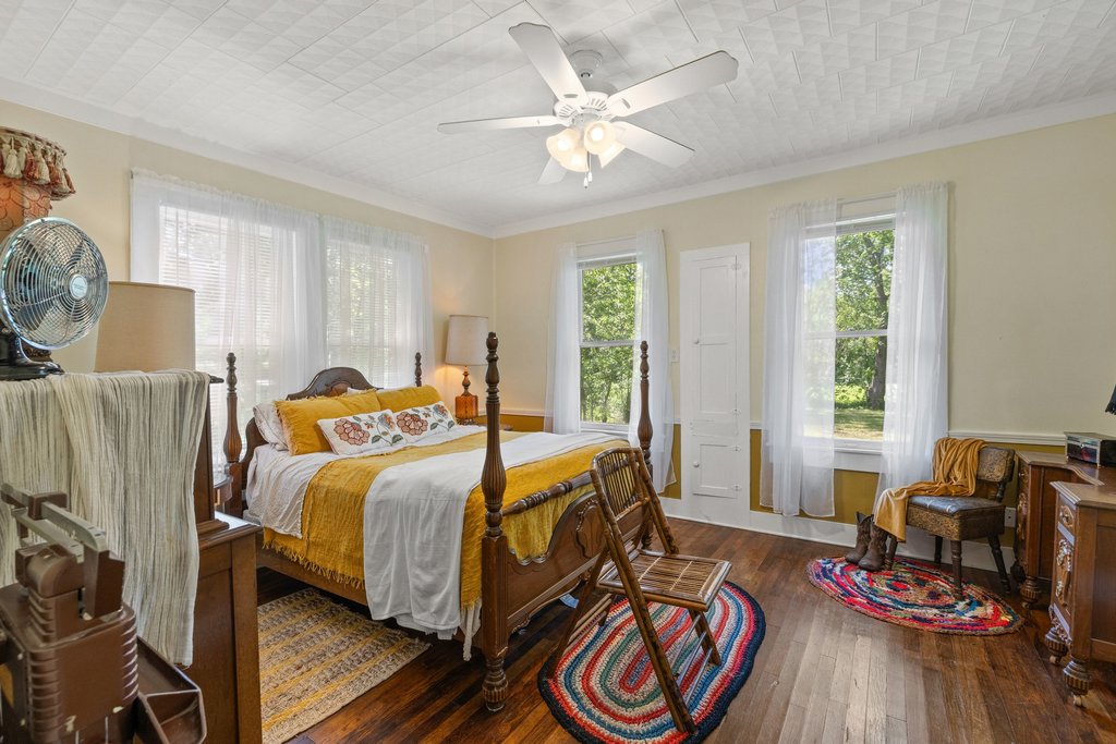 807 Cecelia Street Taylor, TX 76574 - Photo 14 of 24 a bed room with a bed and a chair