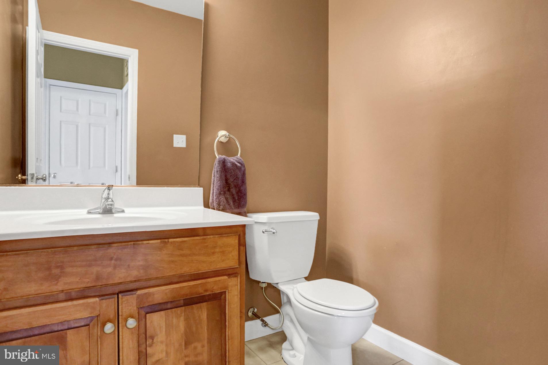 23 Pacific Avenue Reading, PA 19608 - Photo 13 of 38 a bathroom with a sink a toilet and a mirror