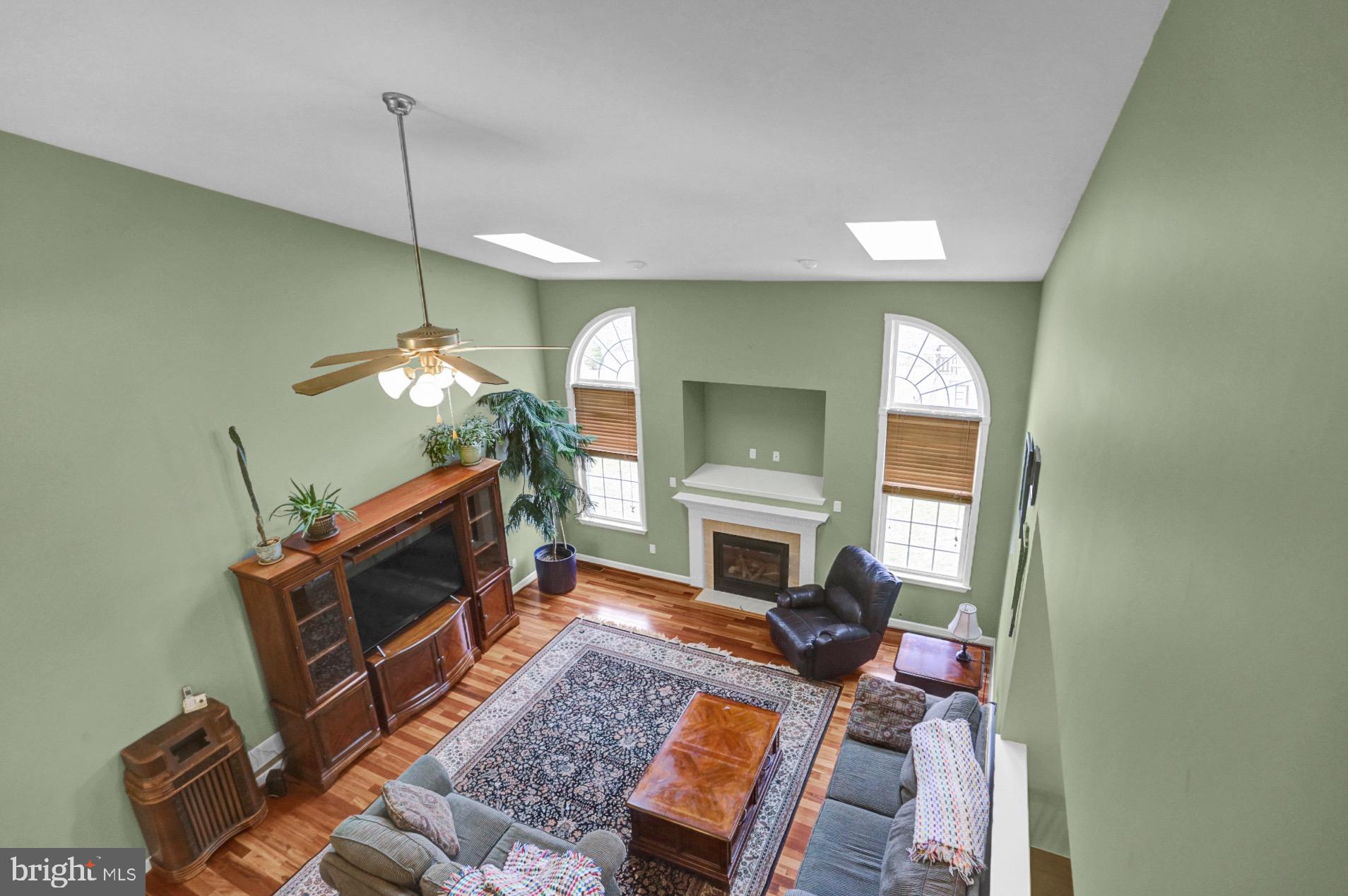 23 Pacific Avenue Reading, PA 19608 - Photo 15 of 38 a living room with furniture a fireplace and a chandelier