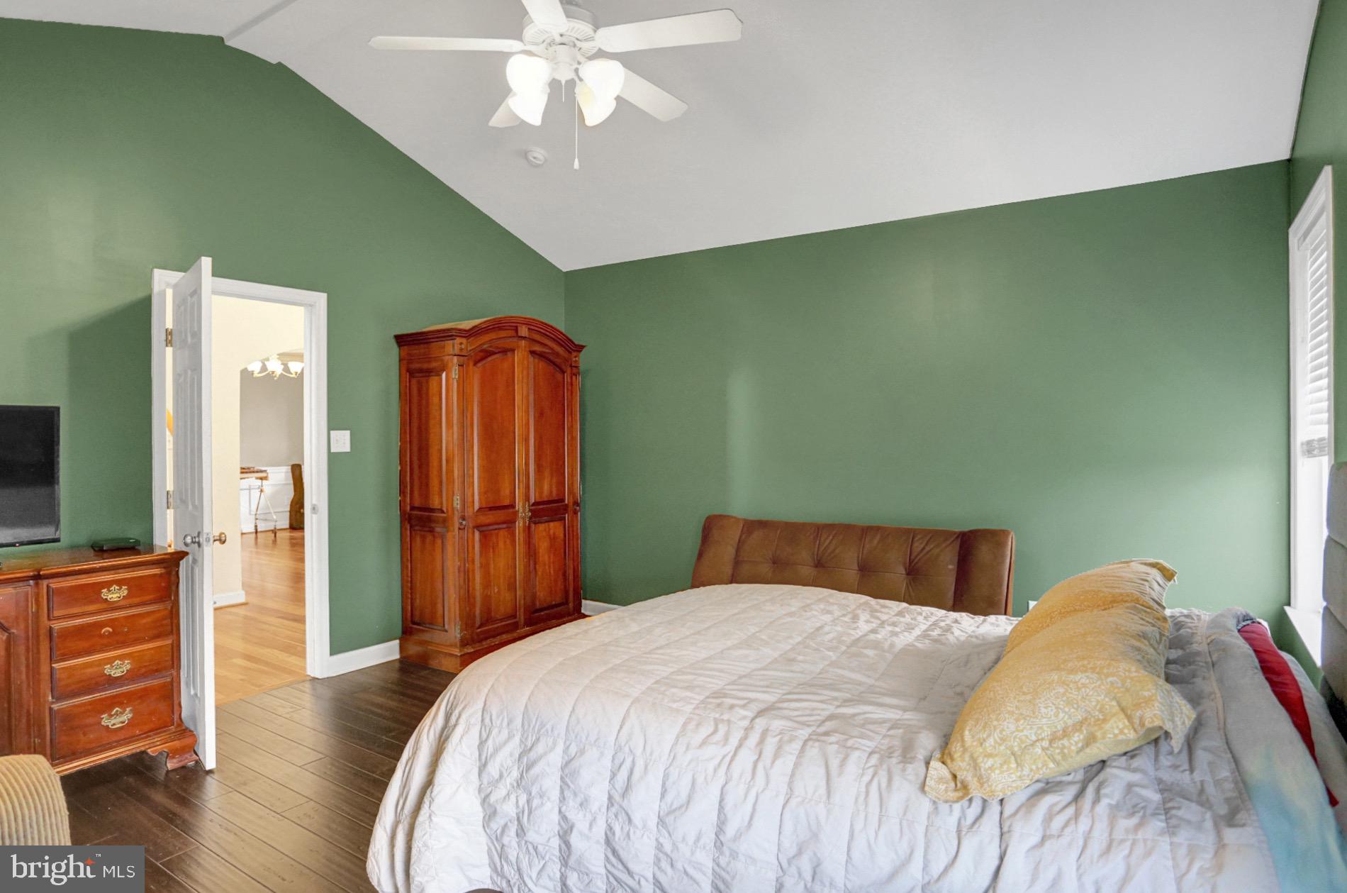 23 Pacific Avenue Reading, PA 19608 - Photo 22 of 38 a bedroom with a bed and wooden floor