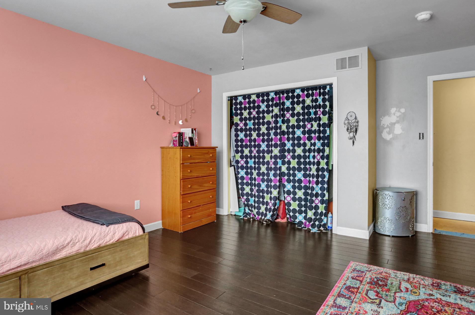 23 Pacific Avenue Reading, PA 19608 - Photo 25 of 38 a bedroom with a bed and wooden floor