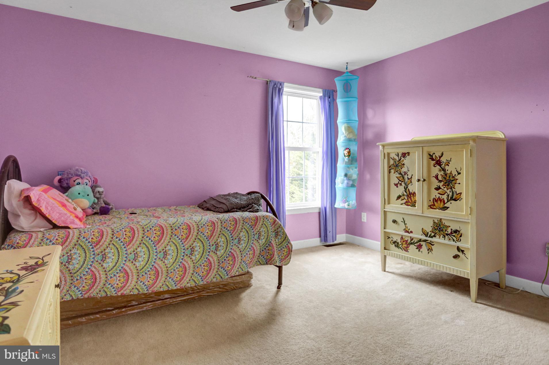 23 Pacific Avenue Reading, PA 19608 - Photo 27 of 38 a bedroom with a bed and a window