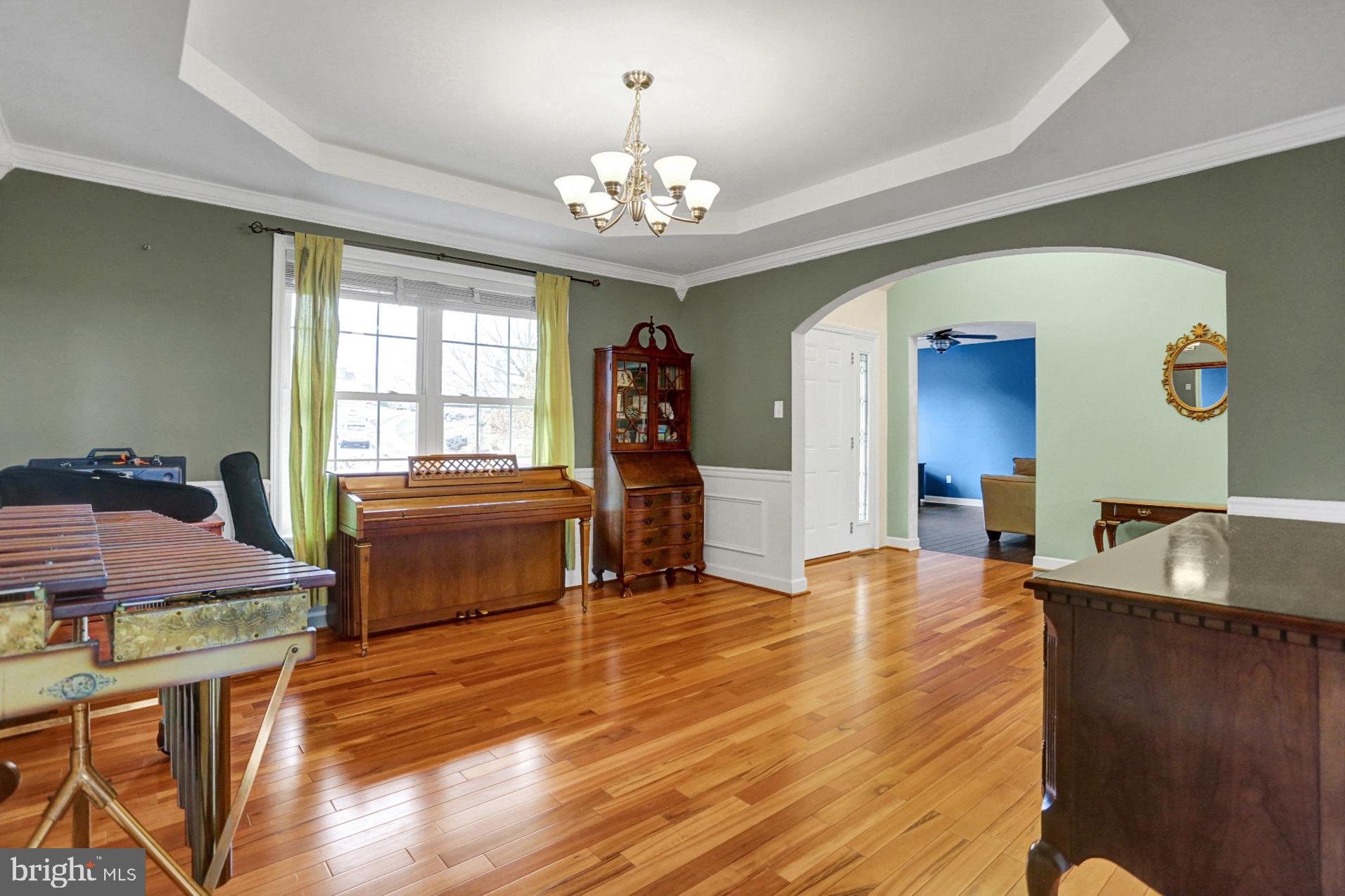 23 Pacific Avenue Reading, PA 19608 - Photo 6 of 38 a living room with furniture and a chandelier