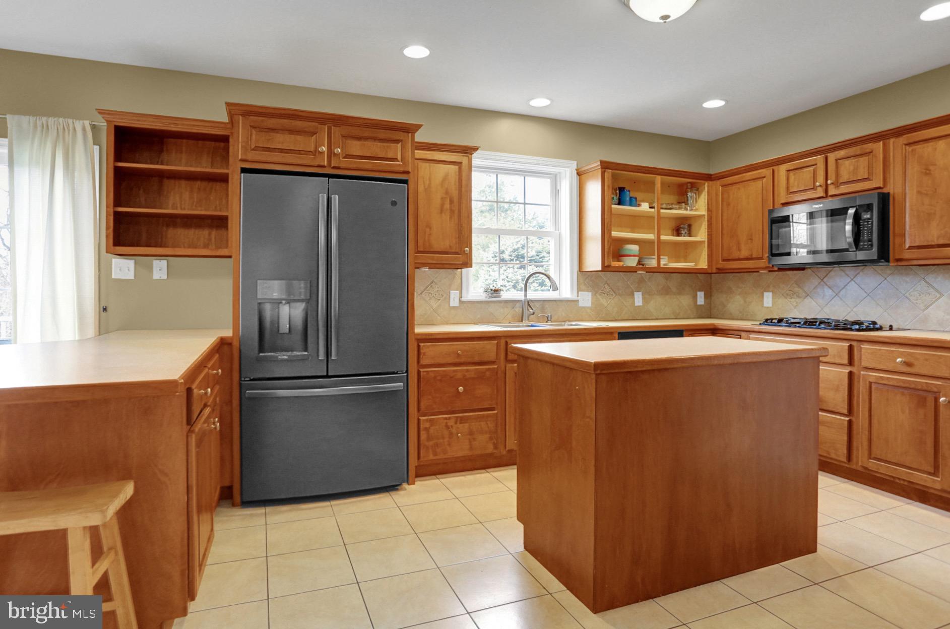 23 Pacific Avenue Reading, PA 19608 - Photo 10 of 38 a kitchen with stainless steel appliances granite countertop a refrigerator and a sink