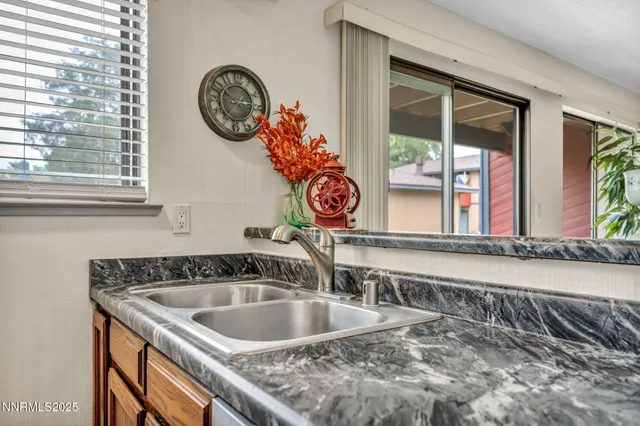 a bathroom with a sink and a large mirror
