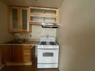 806 South Street Peekskill, NY 10566 - Photo 6 of 9 a kitchen with a stove and a microwave