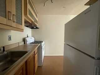 806 South Street Peekskill, NY 10566 - Photo 7 of 9 a kitchen with stainless steel appliances granite countertop a sink and a refrigerator