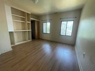 806 South Street Peekskill, NY 10566 - Photo 9 of 9 an empty room with wooden floor and windows