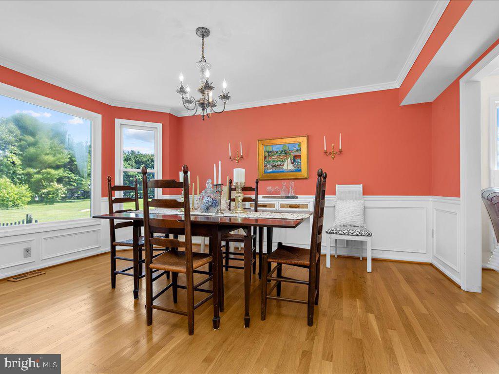 1877 Cherry Road Annapolis, MD 21409 - Photo 11 of 65 Hardwood Floors Add Elegance to Dining Room