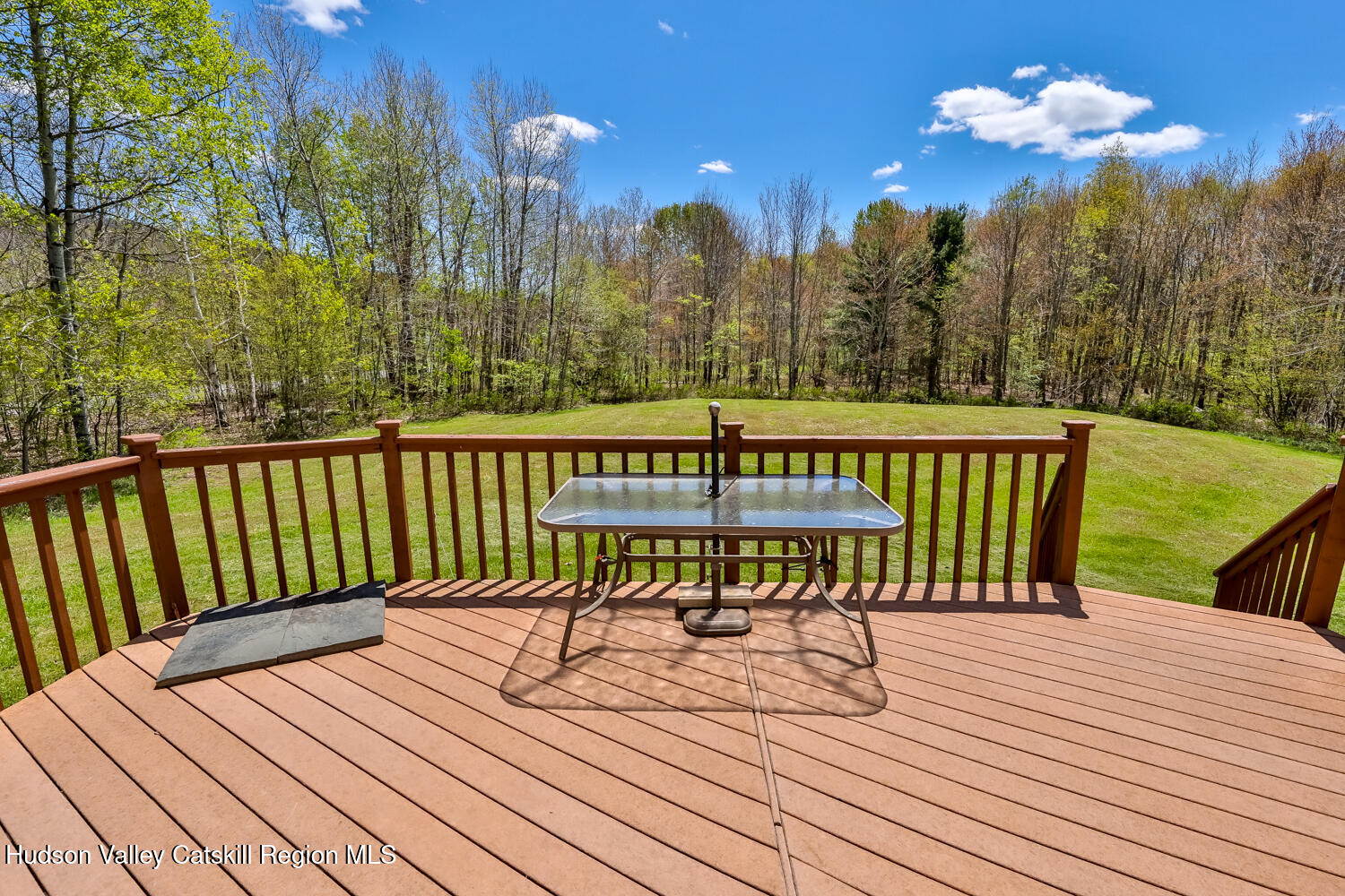 751 Mitchell Hollow Road Windham, NY 12496 - Photo 7 of 37 a view of a chairs on wooden deck