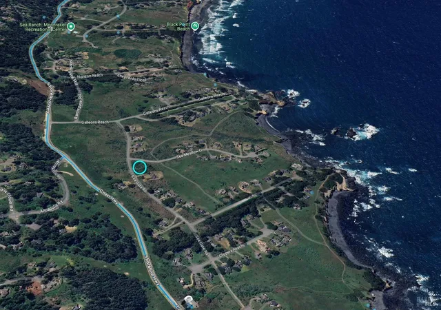 an aerial view of a residential houses with outdoor space