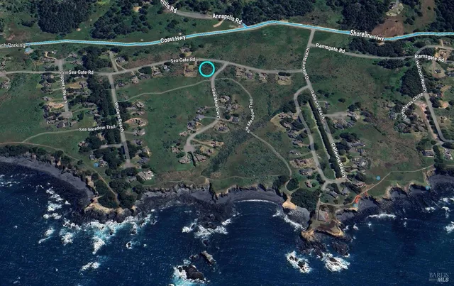 a view of a wooden fence and a pathway