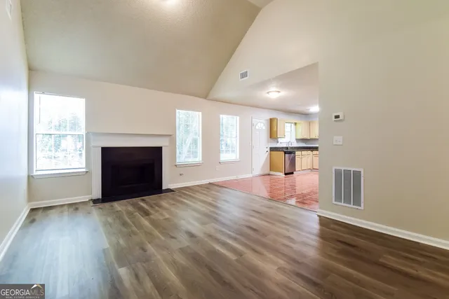 a view of a livingroom with wooden floor