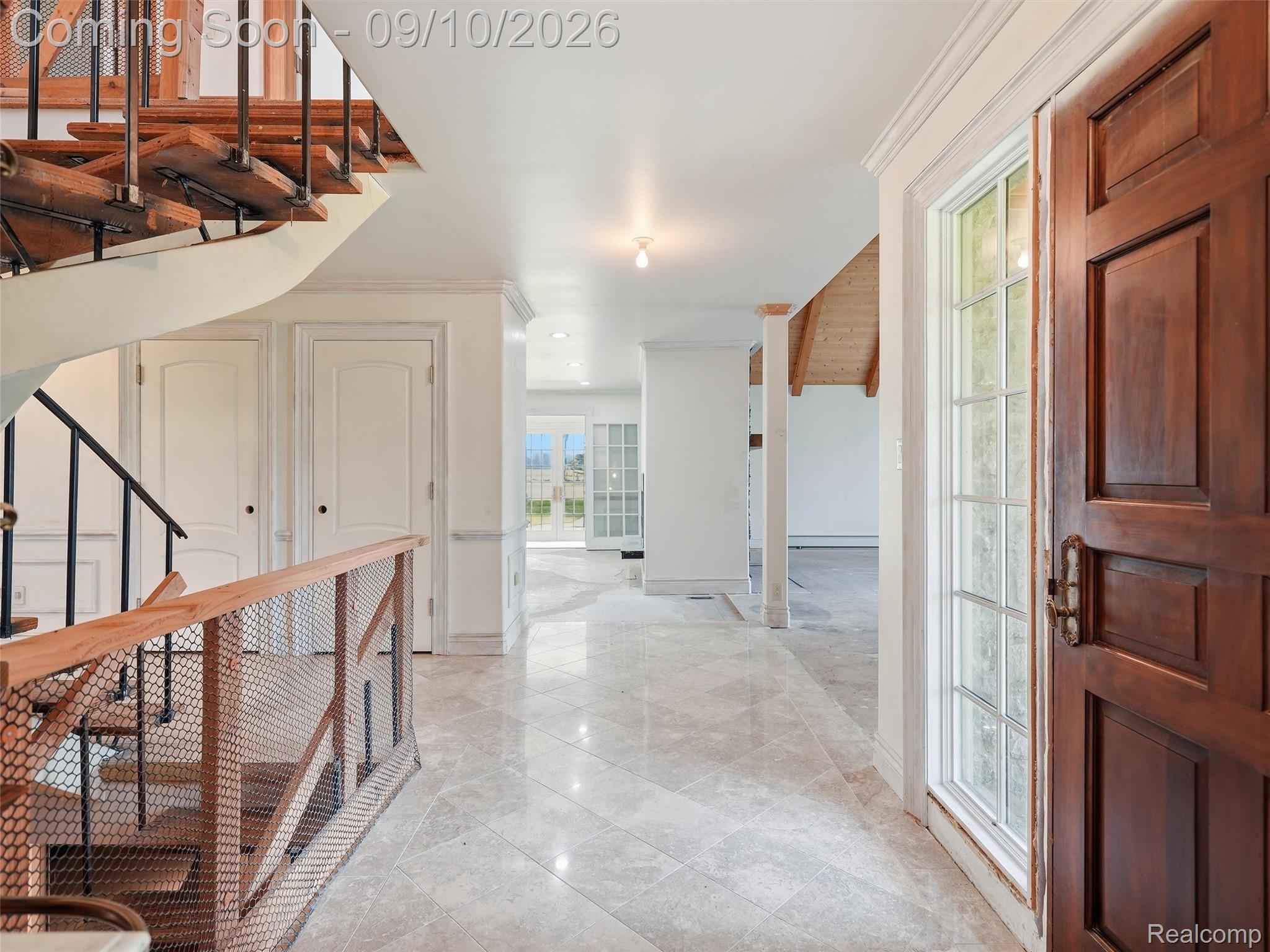 61400 Romeo Plank Road Ray, MI 48096 - Photo 23 of 99 Hardwood entry door with sidelight, polished tile flooring, curved wood staircase with metal railing, and recessed lighting