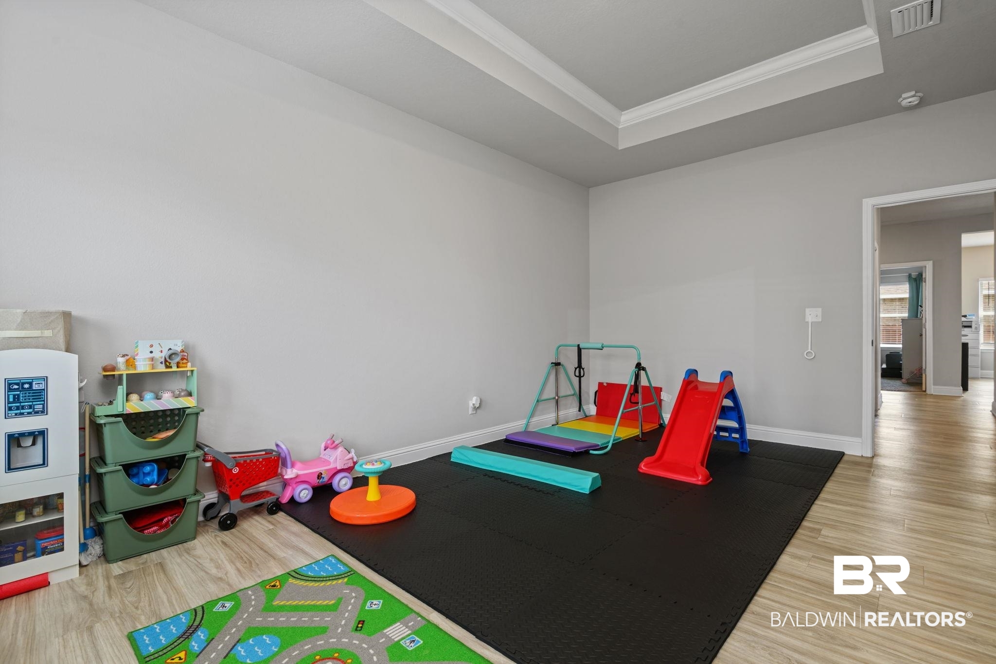 2183 Meadowview Loop Semmes, AL 36575 - Photo 25 of 58 Game room with light wood-type flooring, crown molding, and a raised ceiling