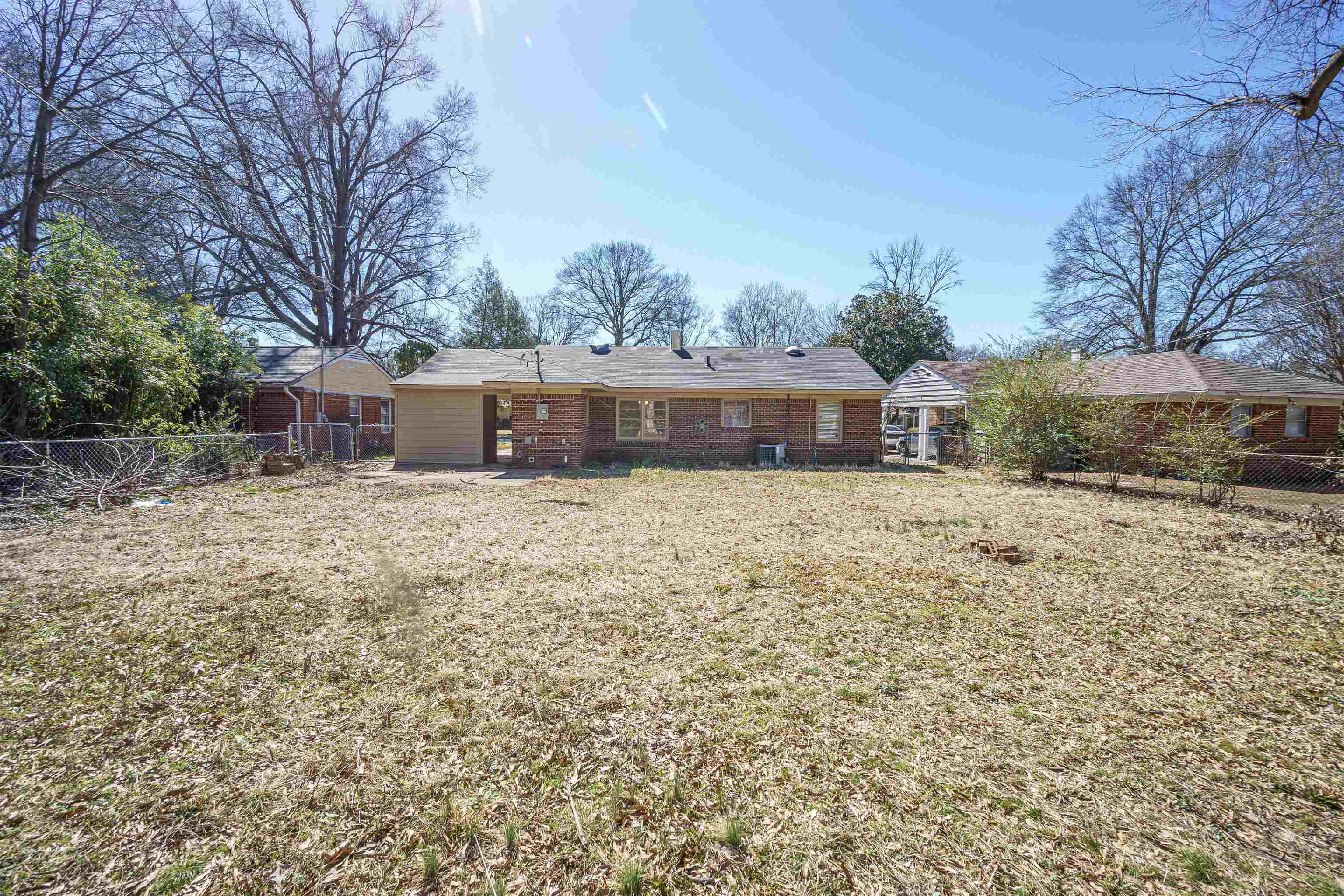4590 Monaco Road Memphis, TN 38117 - Photo 14 of 14 a view of residential houses with yard and trees