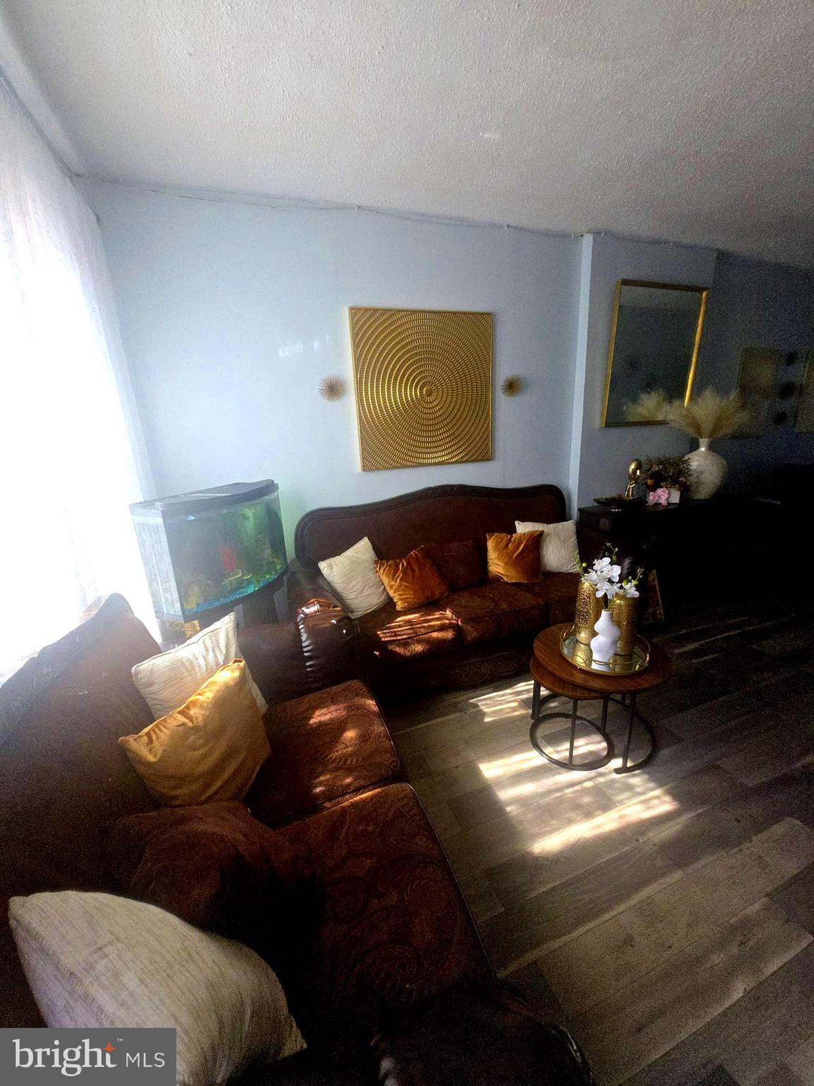 124 Pear Street Reading, PA 19601 - Photo 3 of 19 a living room with furniture flowerpot and a flat screen tv