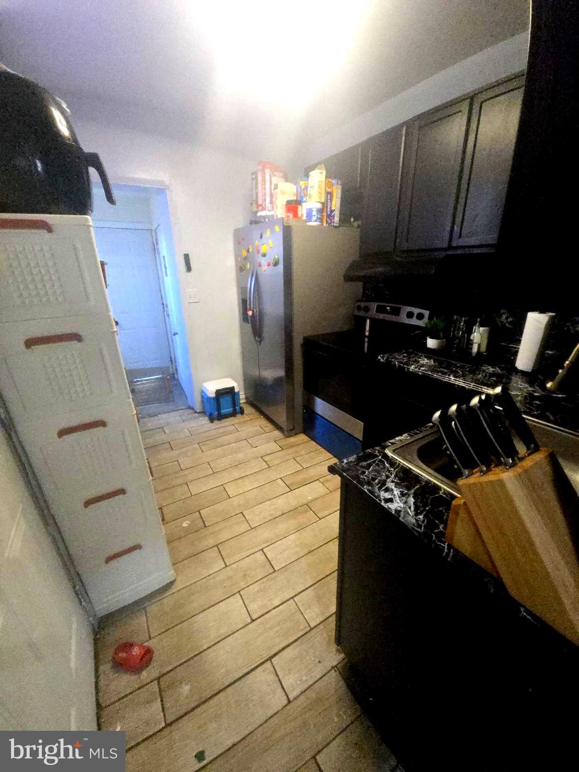 124 Pear Street Reading, PA 19601 - Photo 6 of 19 a kitchen with a sink and a refrigerator