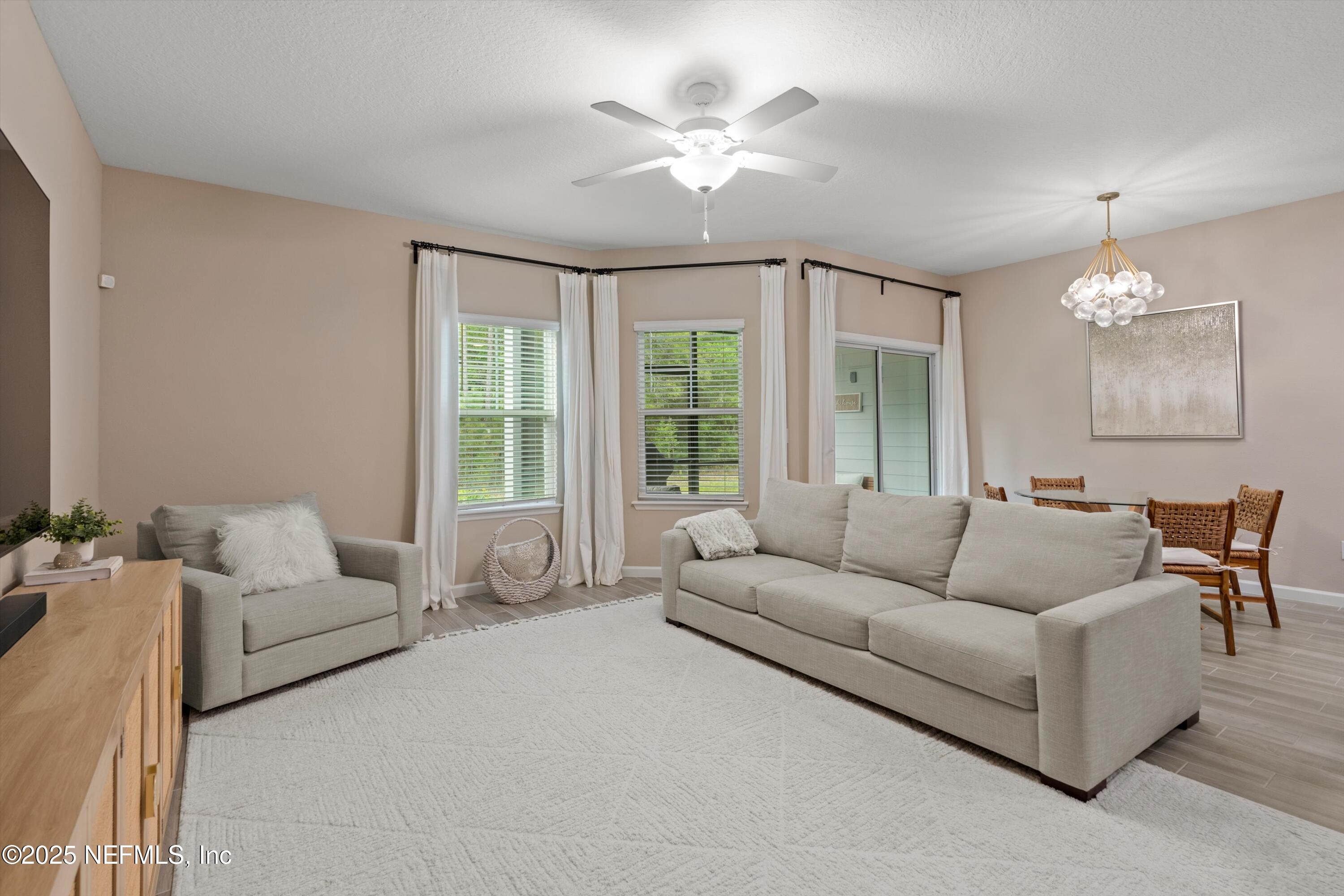 352 Boracay Circle St. Johns, FL 32259 - Photo 15 of 45 a living room with furniture and a large window
