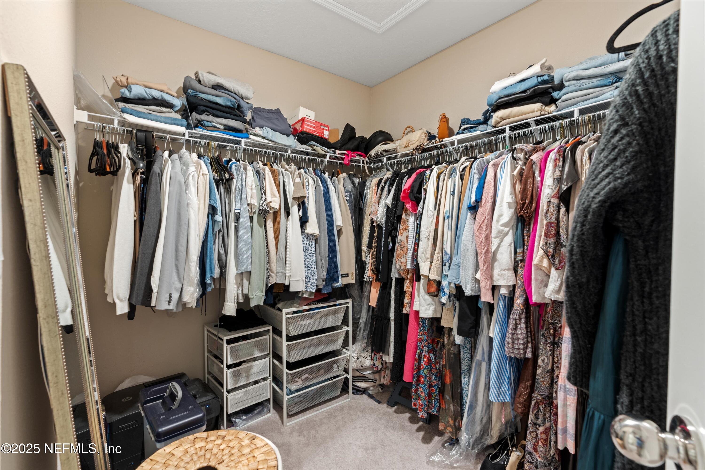 352 Boracay Circle St. Johns, FL 32259 - Photo 22 of 45 a view of walk in closet with clothes