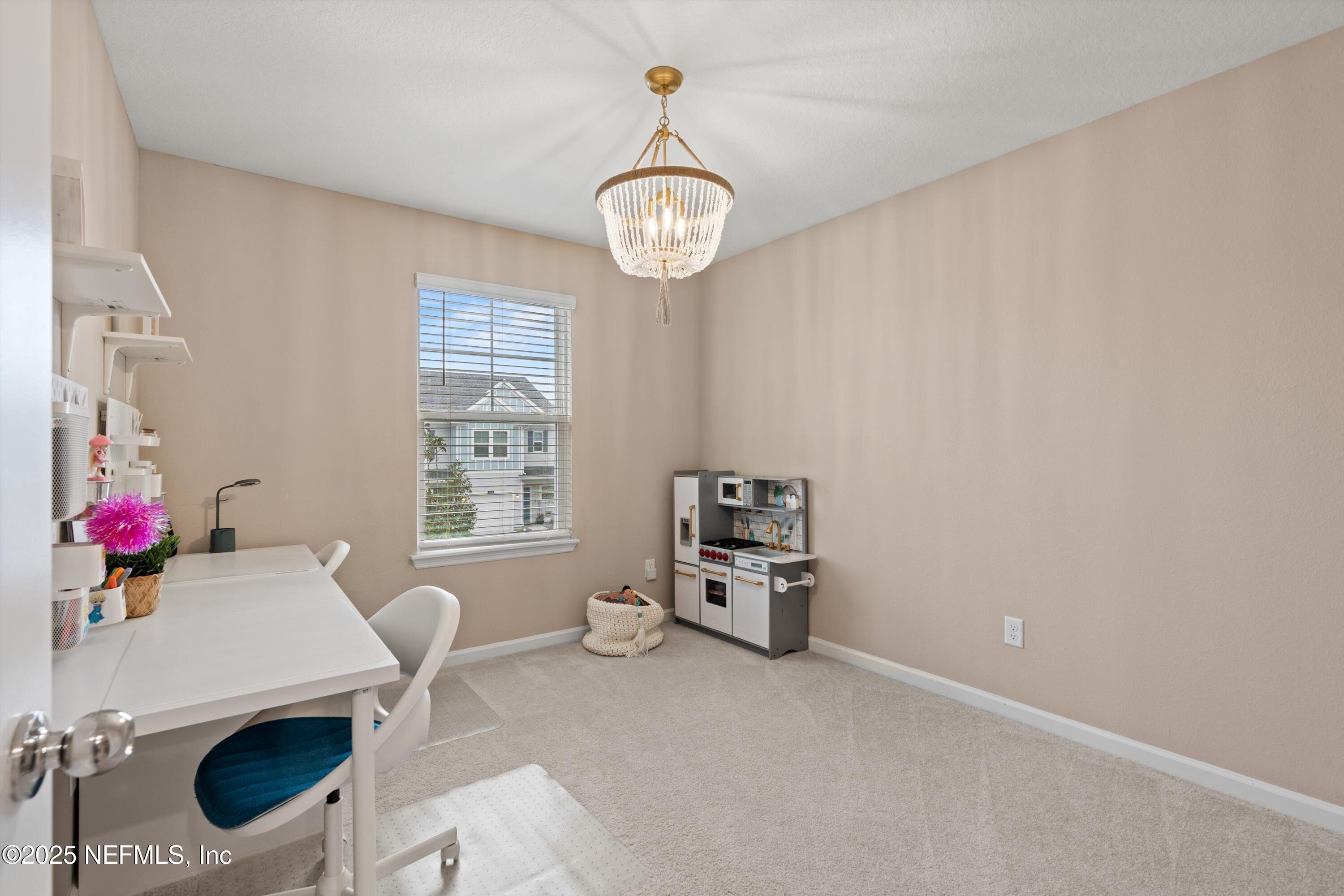 352 Boracay Circle St. Johns, FL 32259 - Photo 23 of 45 a view of dining room with furniture and a chandelier