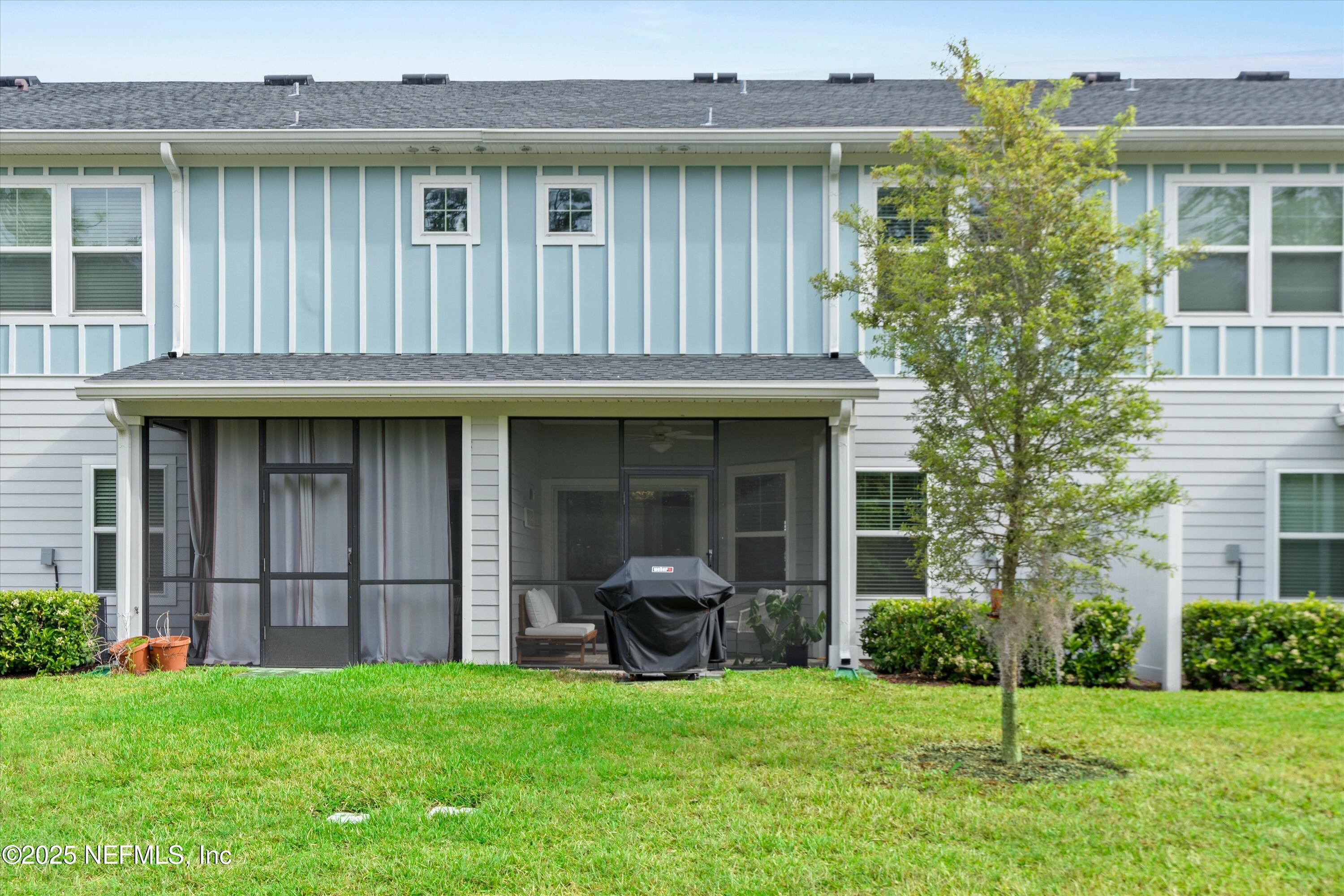 352 Boracay Circle St. Johns, FL 32259 - Photo 28 of 45 a view of a house with a yard and a large tree