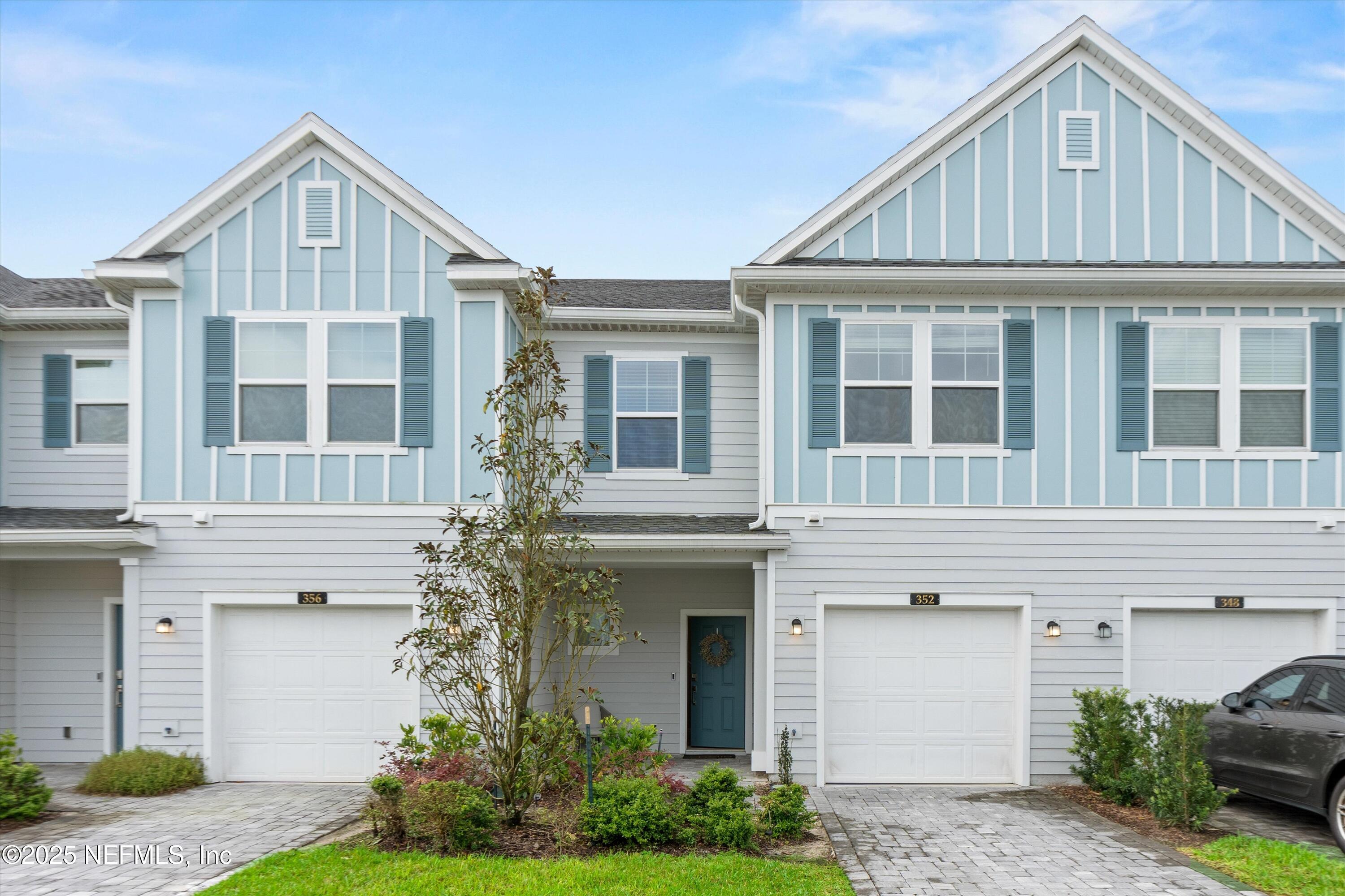 352 Boracay Circle St. Johns, FL 32259 - Photo 3 of 45 a front view of a house with a garden