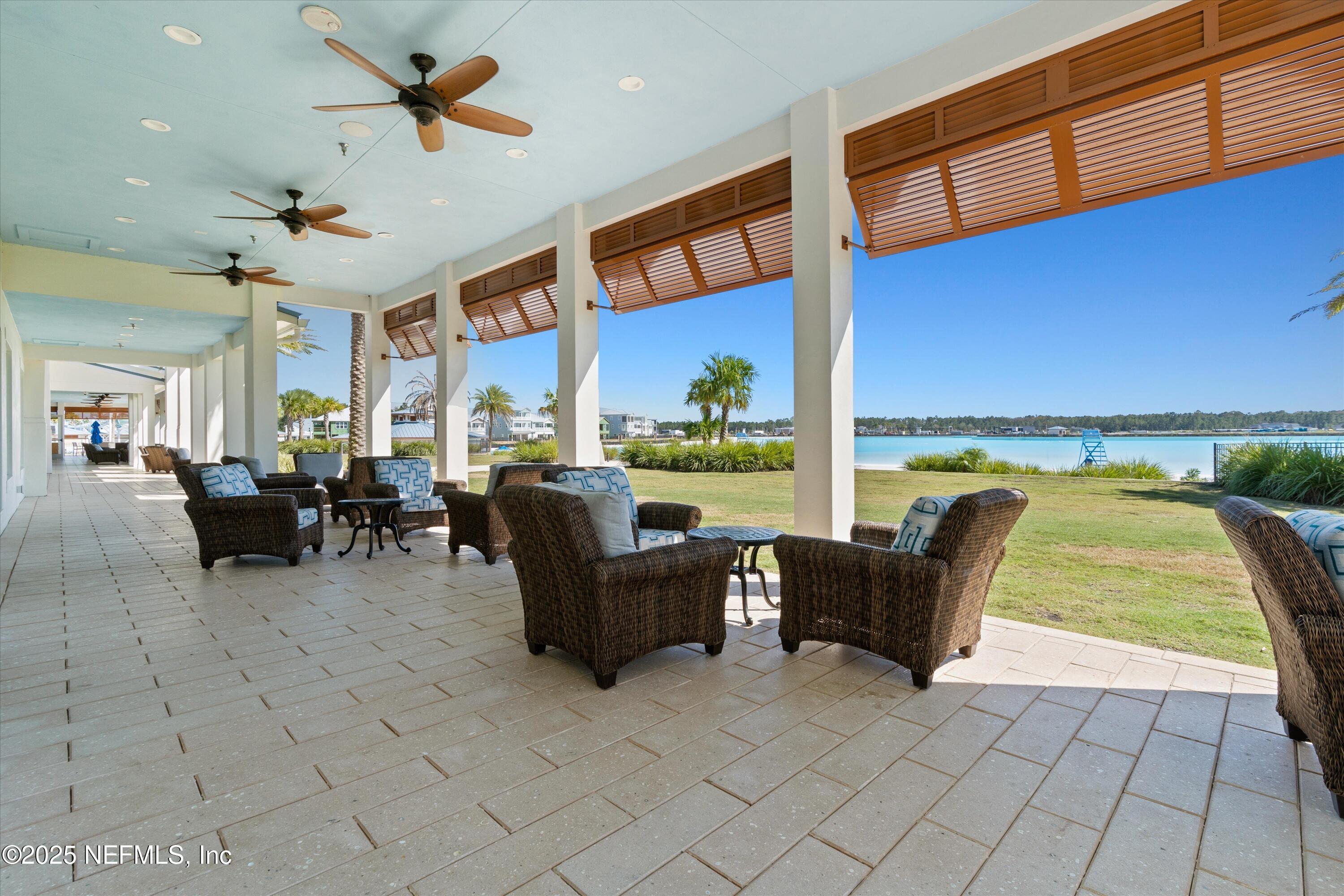 352 Boracay Circle St. Johns, FL 32259 - Photo 33 of 45 a living room with furniture and a floor to ceiling window