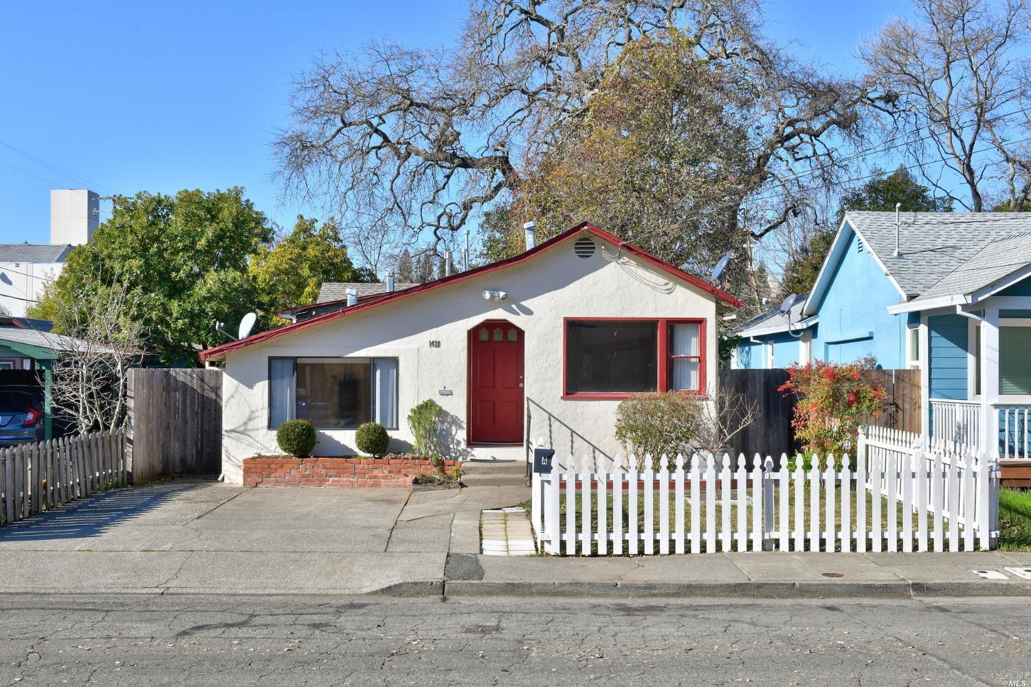 1421 Slater Street Santa Rosa, CA 95404 - Photo 1 of 1 a front view of house yard with large trees