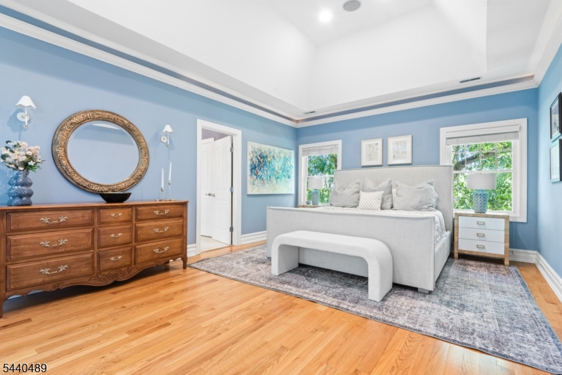 99 East Lindsley Road Cedar Grove, NJ 07009 - Photo 22 of 41 a spacious bedroom with a large bed and a window