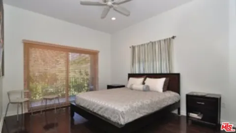 a bedroom with a bed and a table