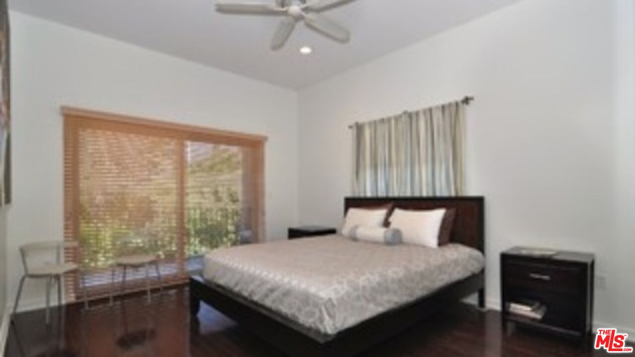 4447 Calhoun Avenue Sherman Oaks, CA 91423 - Photo 15 of 28 a bedroom with a bed and a table