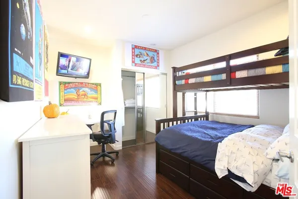 a bedroom with a bed and furniture