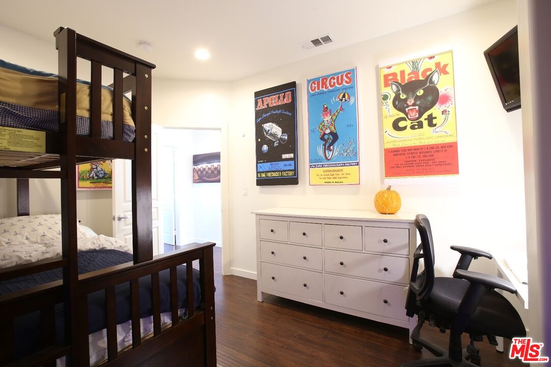 4447 Calhoun Avenue Sherman Oaks, CA 91423 - Photo 17 of 28 a view of a bedroom with furniture and wooden floor