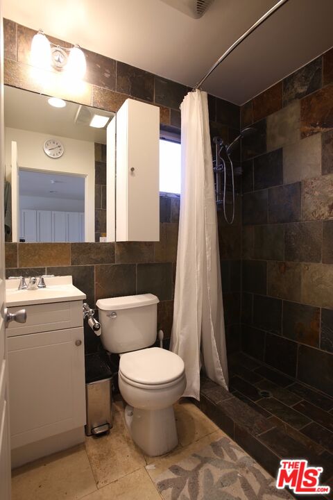 4447 Calhoun Avenue Sherman Oaks, CA 91423 - Photo 19 of 28 a bathroom with a toilet and a shower