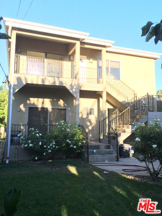 4447 Calhoun Avenue Sherman Oaks, CA 91423 - Photo 25 of 28 a front view of a house with a yard