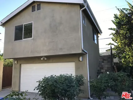 a house with trees in front of it