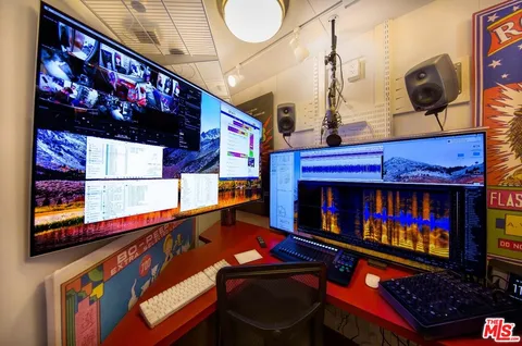 a room with lots of furniture and a flat screen tv