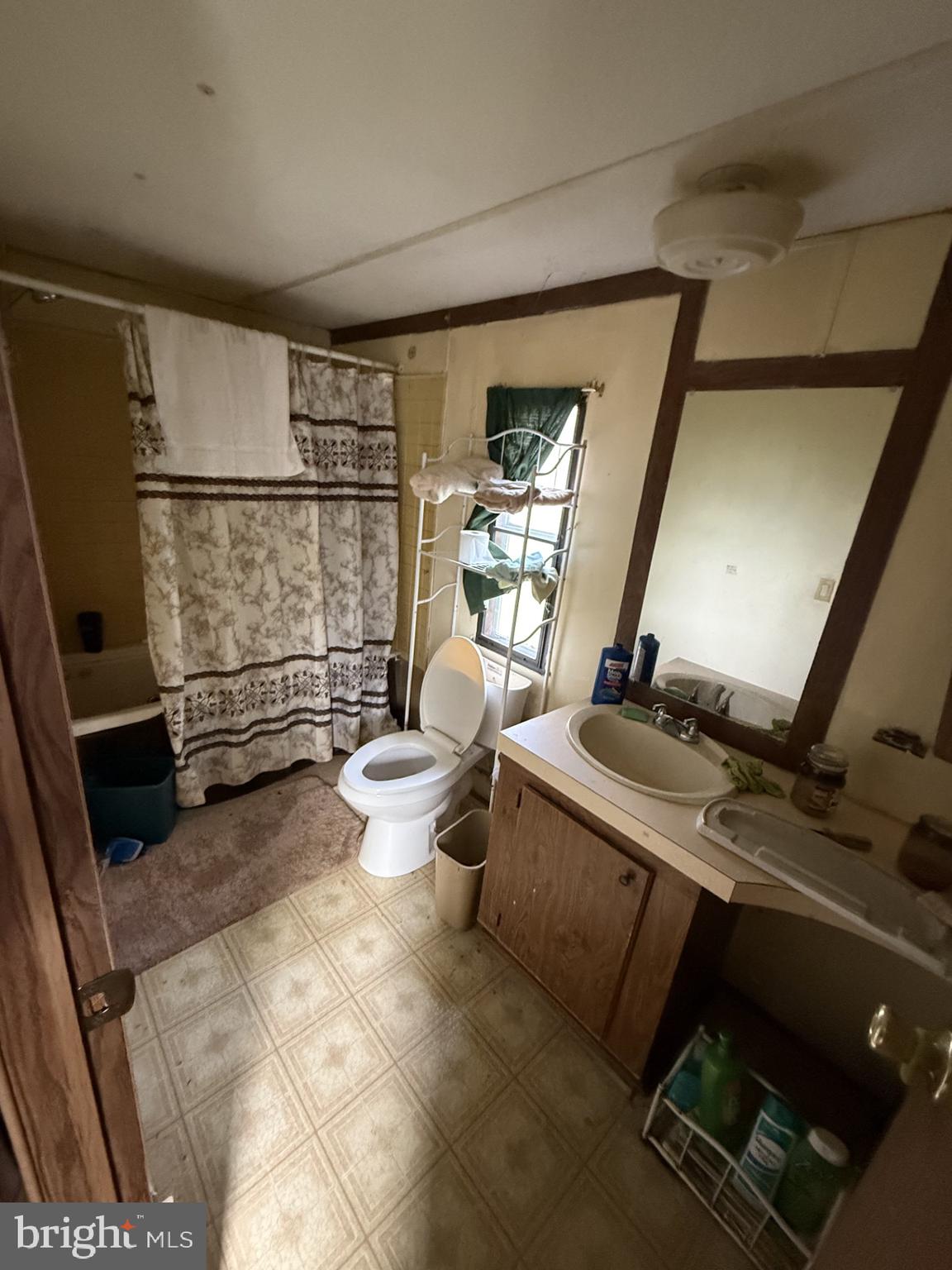 9121 Deal Island Road Deal Island, MD 21821 - Photo 3 of 12 a living room with furniture a air conditioner vent and a window