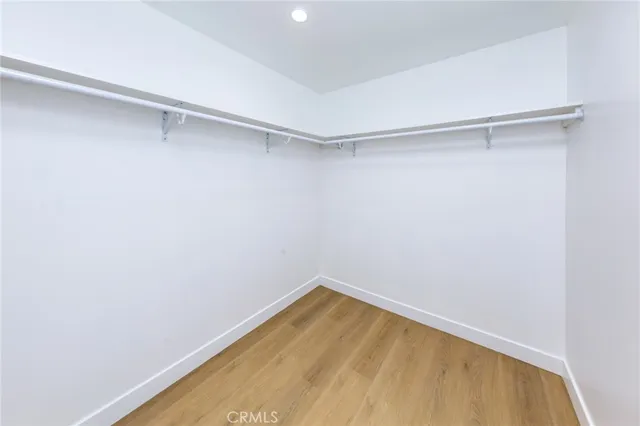 a view of a room with shelf on the wall