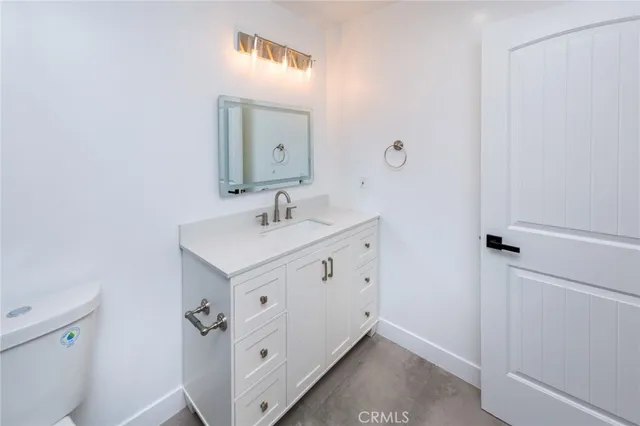 a bathroom with a sink and mirror
