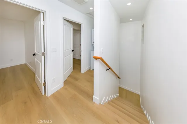 a view of a hallway with staircase
