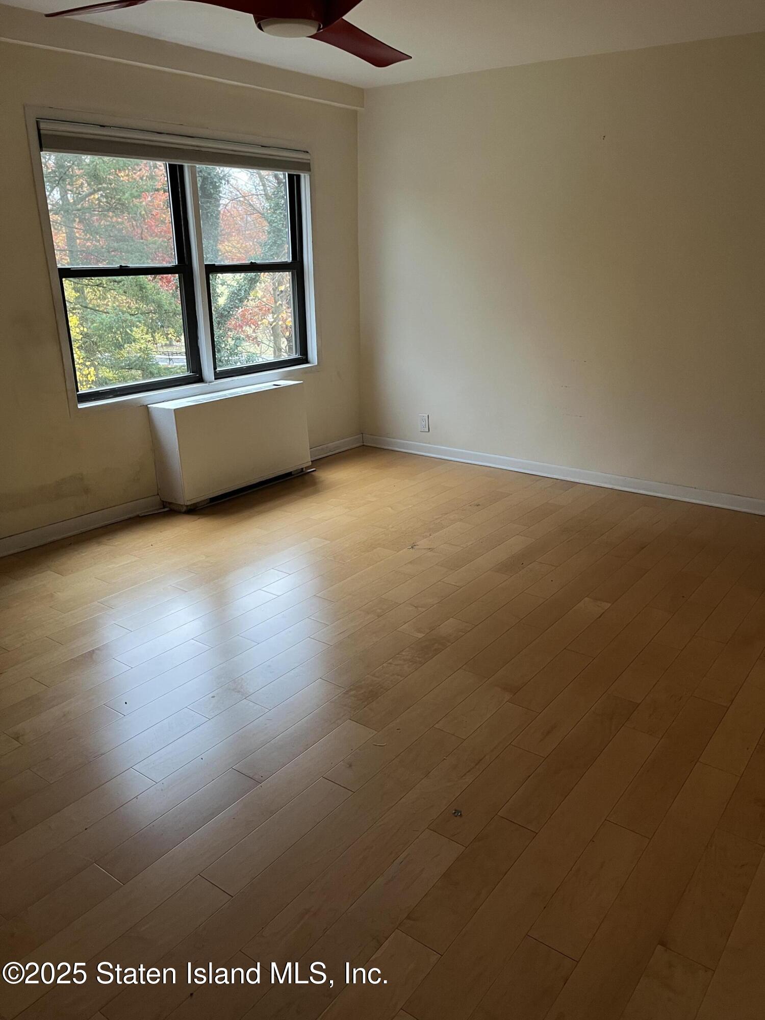 1100 Clove Road, Unit 2L Staten Island, NY 10301 - Photo 15 of 20 an empty room with windows