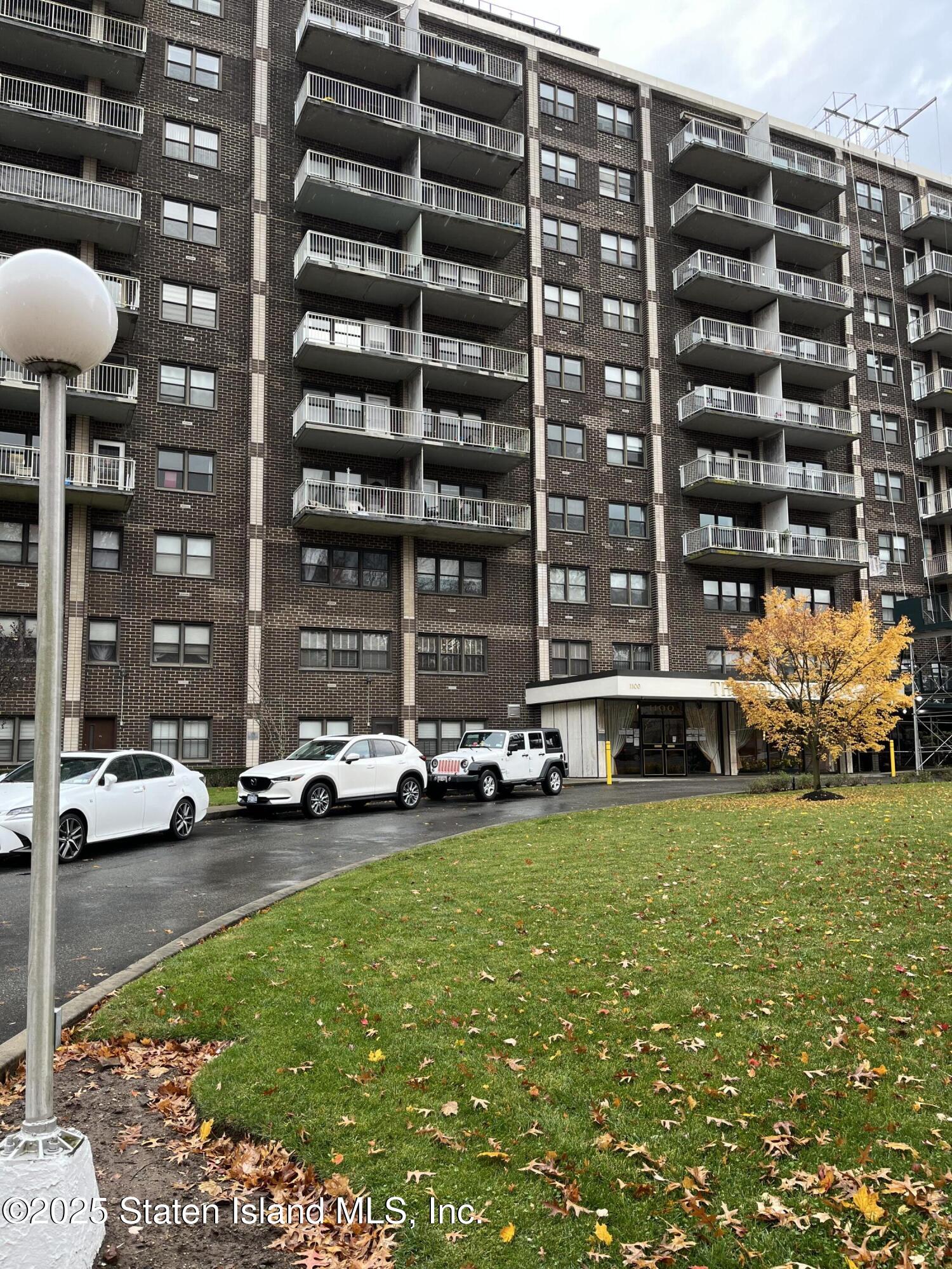 1100 Clove Road, Unit 2L Staten Island, NY 10301 - Photo 2 of 20 a view of a cars park in front of a building