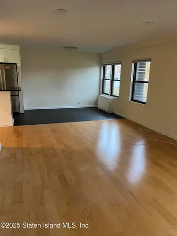 a kitchen with a refrigerator and a sink