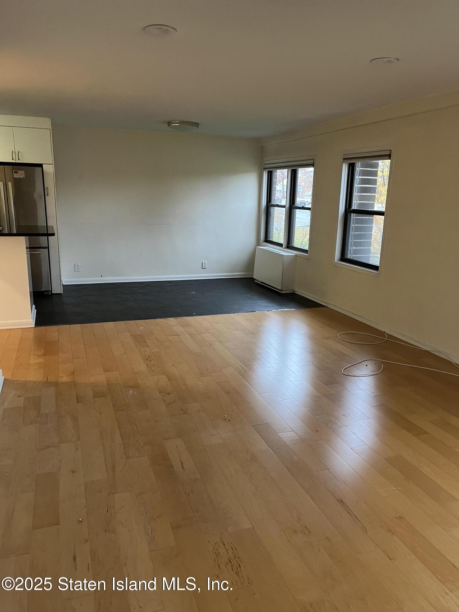 1100 Clove Road, Unit 2L Staten Island, NY 10301 - Photo 7 of 20 a view of an empty room with a window