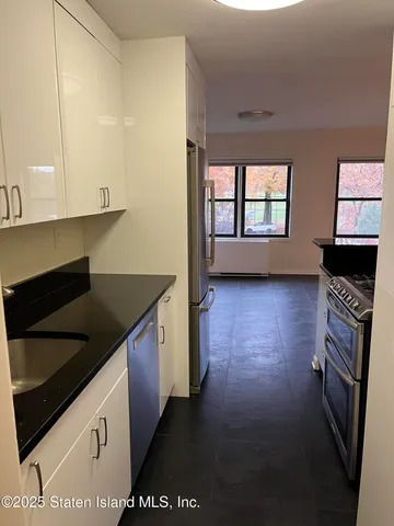 a kitchen with a stove and a microwave