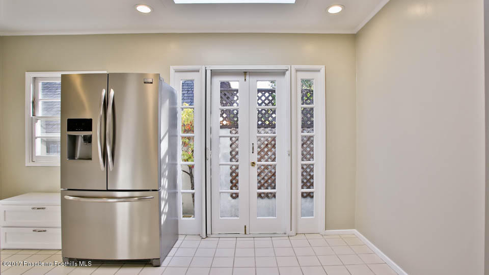 330 Fillmore Street Pasadena, CA 91106 - Photo 13 of 25 a kitchen with stainless steel appliances a refrigerator and cabinets